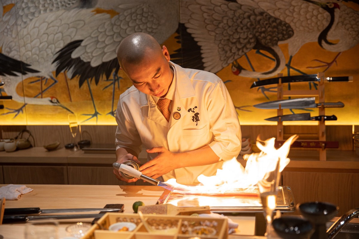 Chef Linh behind Shin-Kon’s omakase counter.

