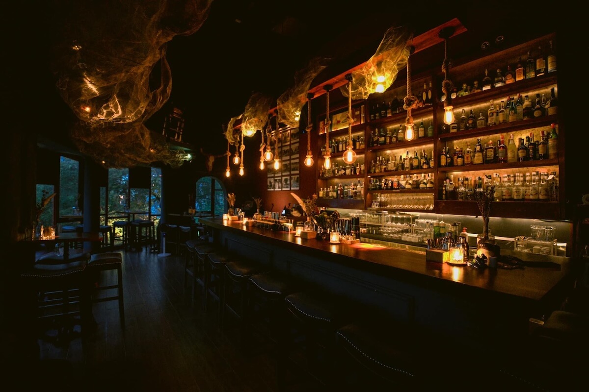 A dark speakeasy as nightfalls.