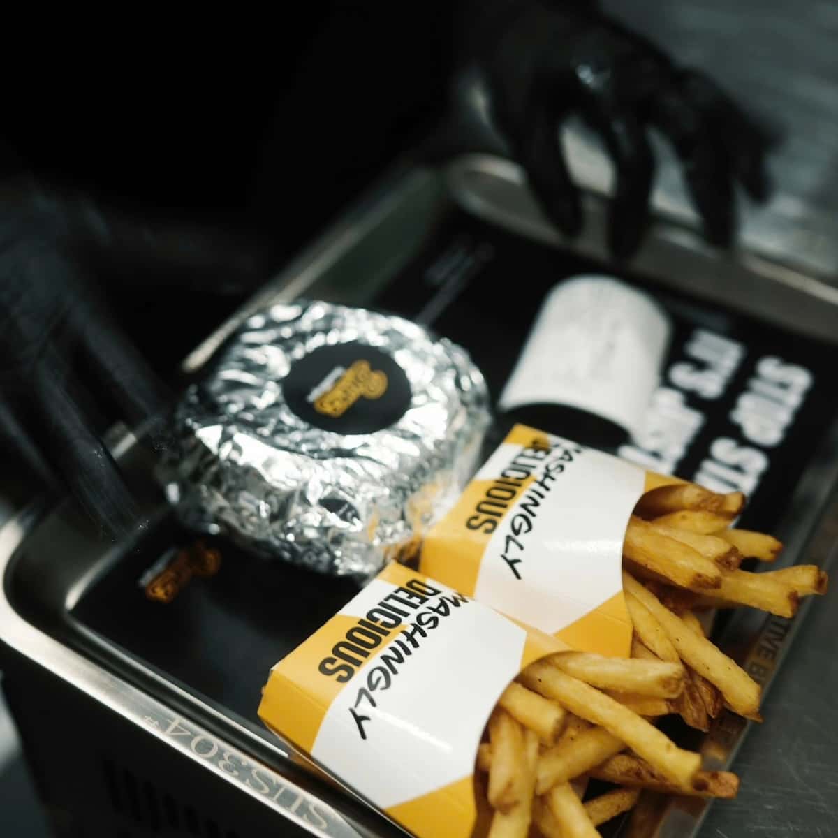 a tray of french fries and a wrapper at Bunz Smash Burgers in Saigon
