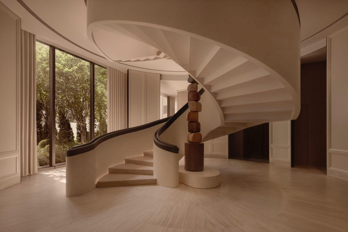 Sculpture by spiral staircase.