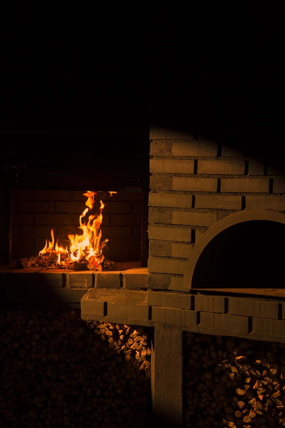 A fire and a brick fireplace.