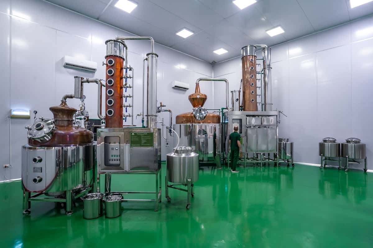 A room with a green floor and machinery.
