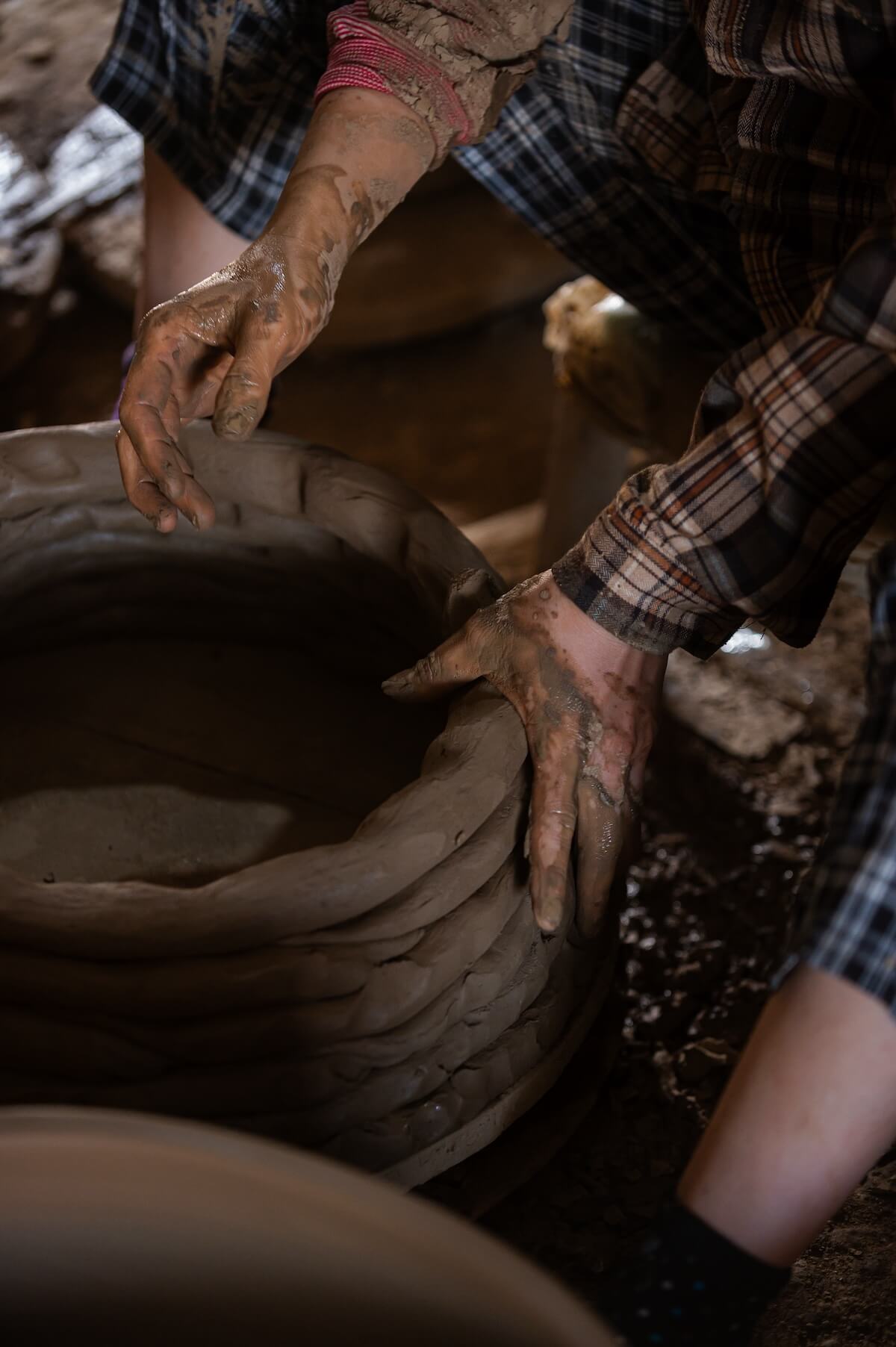A potter with clay pot.