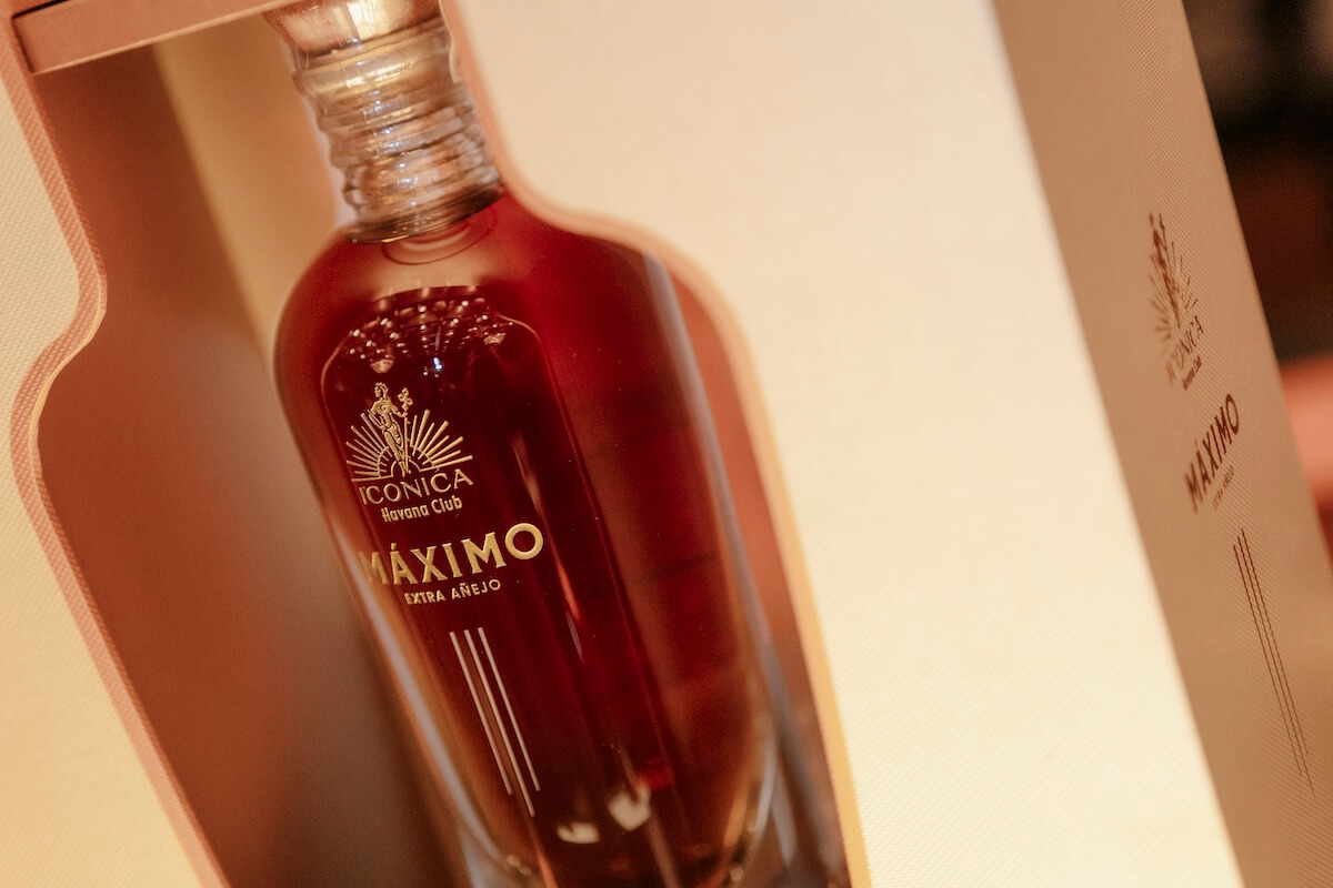 A bottle in a case with the word Maximo on it.