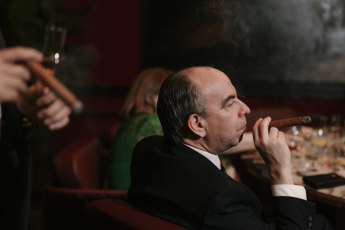 People smoking cigars.