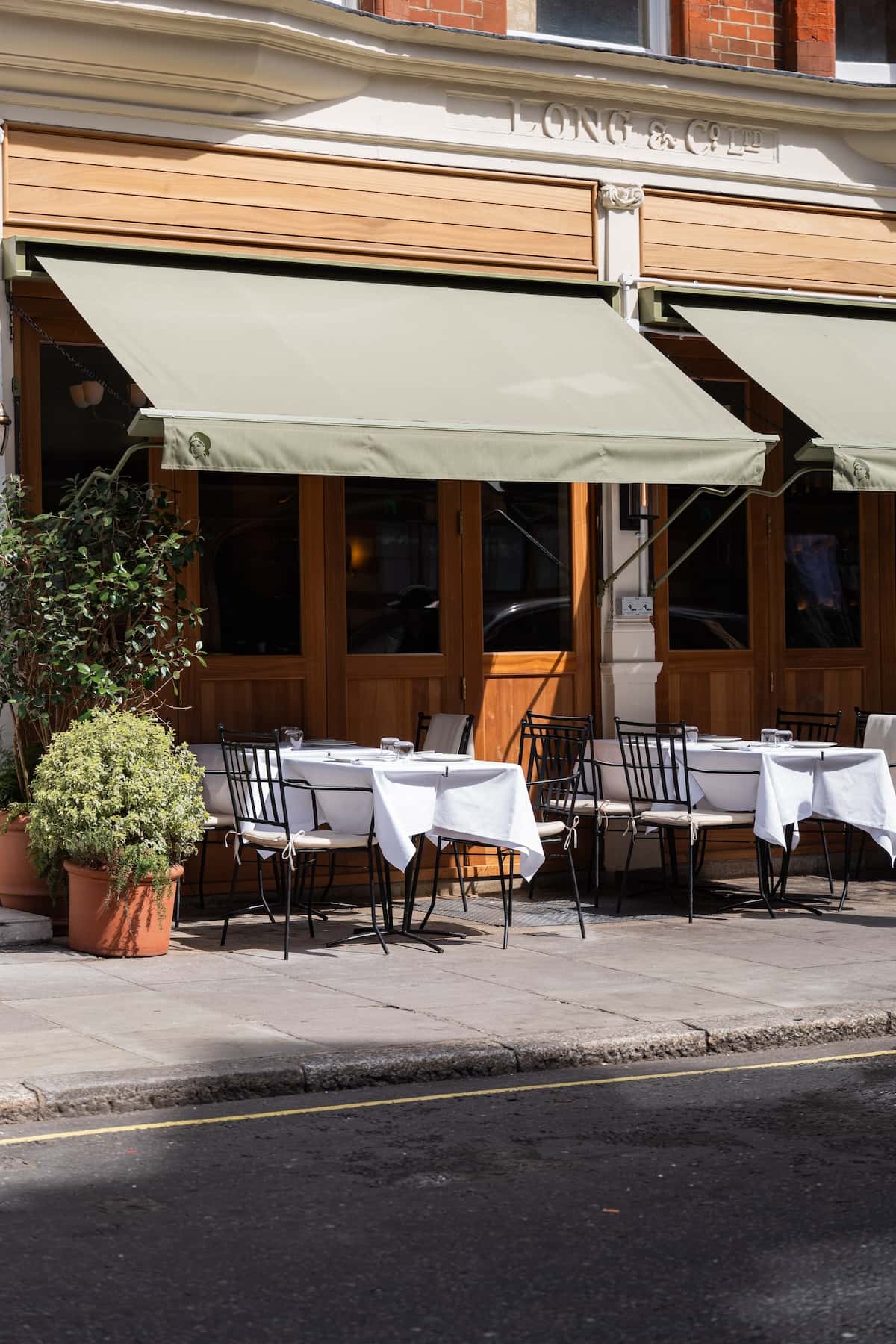 A restaurant with tables outside.