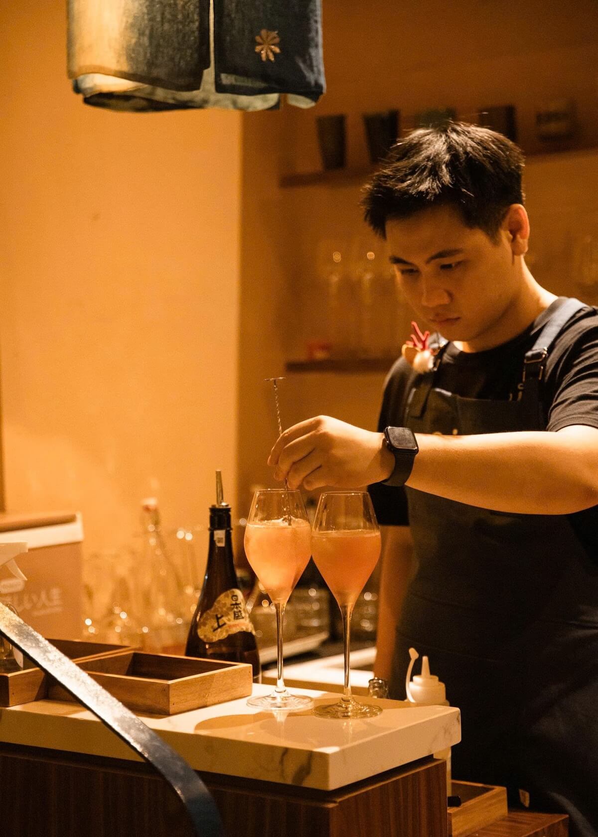A man with two drinks.